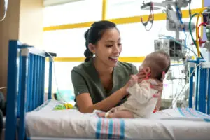 a nurse holding a baby