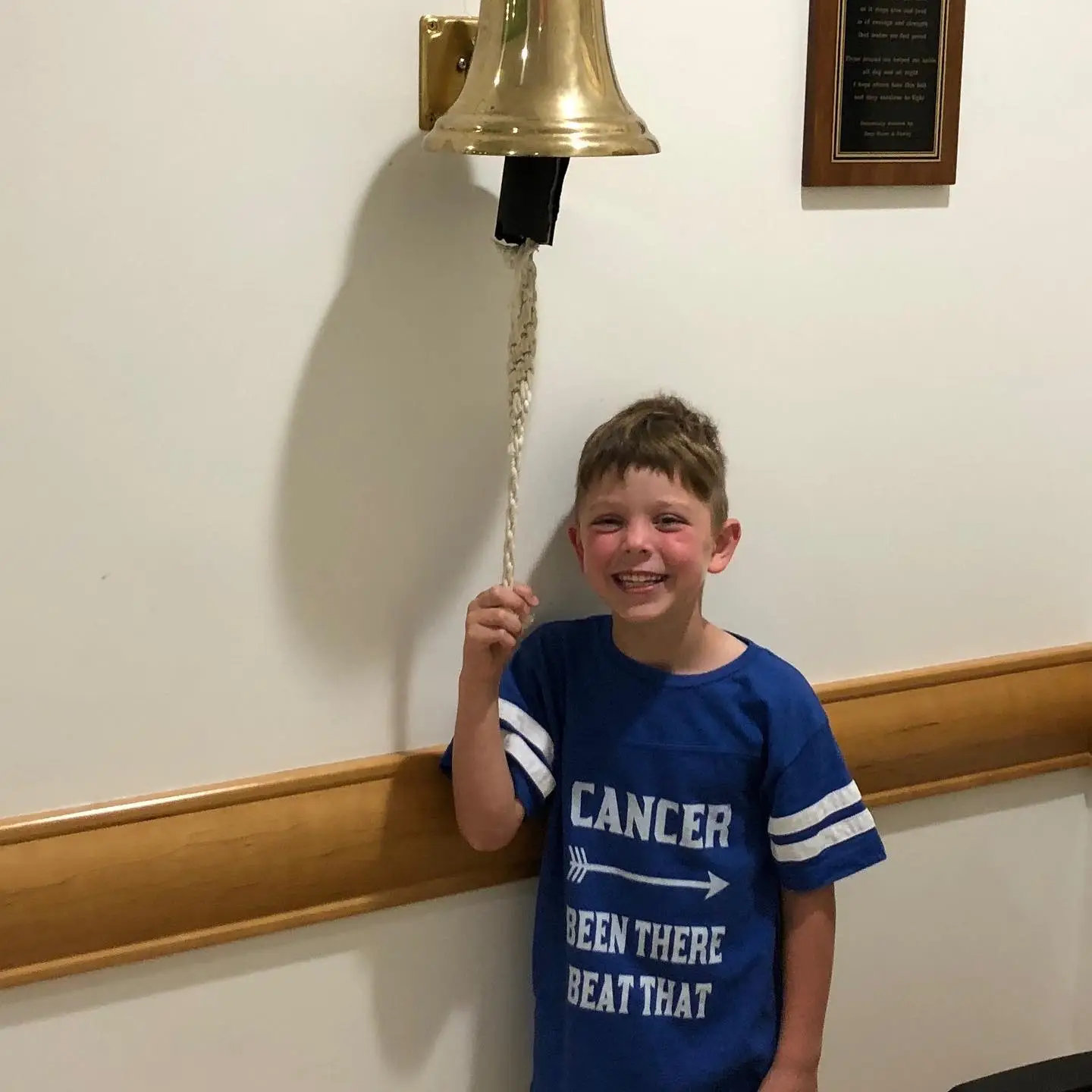 Miles ringing the bell at UPMC Children's