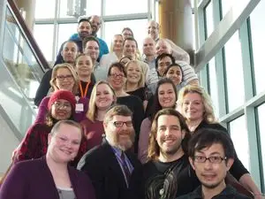 Dr. Bates with his team on a stairwell