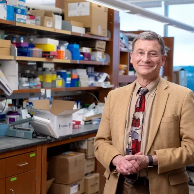 Dr. Vockley standing at his lab bench