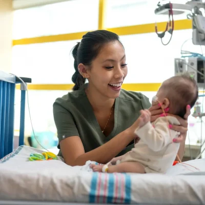 a nurse holding a baby