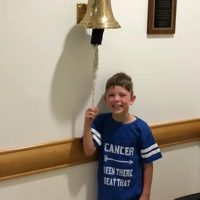 Miles ringing the bell at UPMC Children's